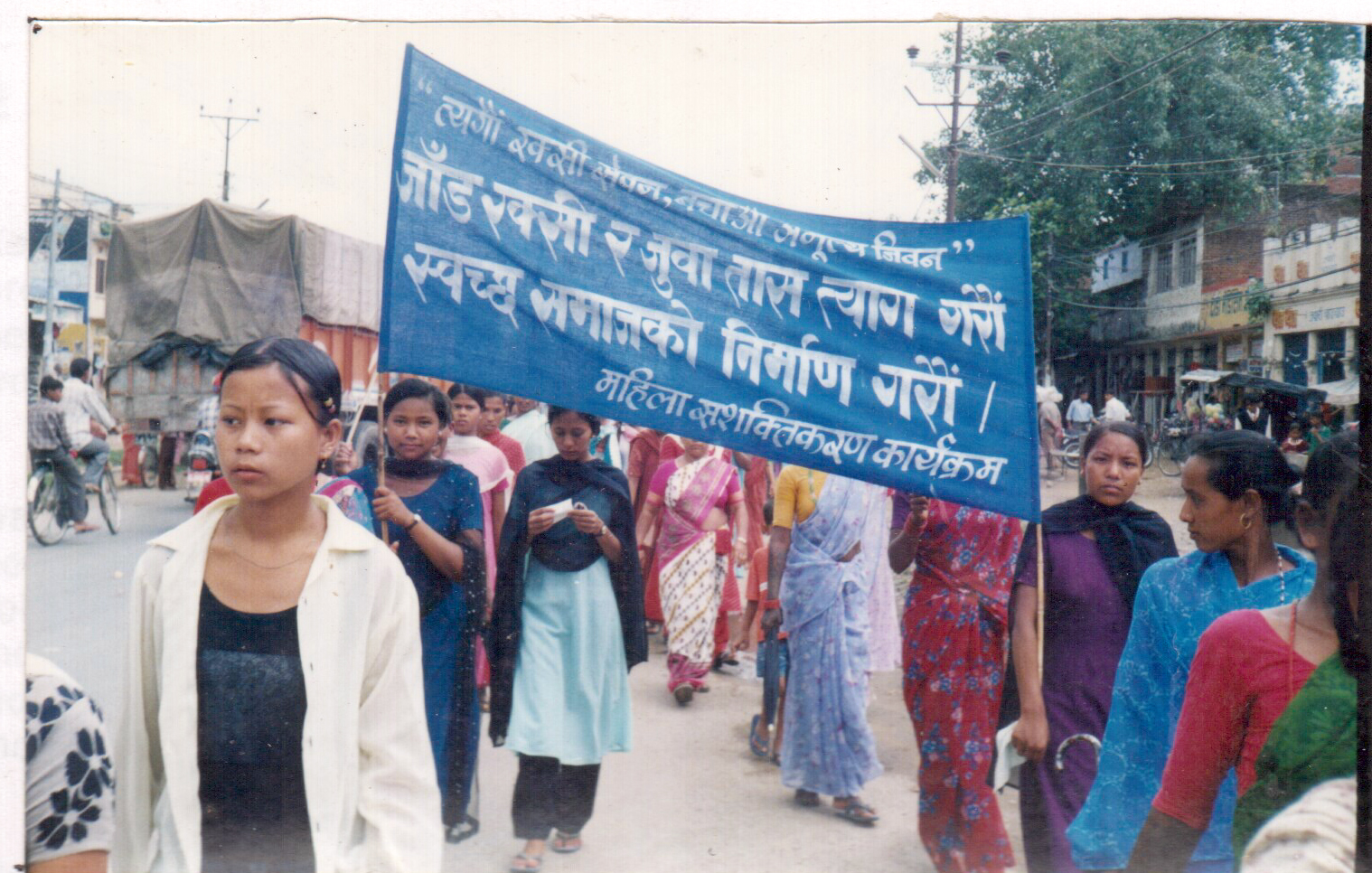 Women marching together in a public advocacy campaign